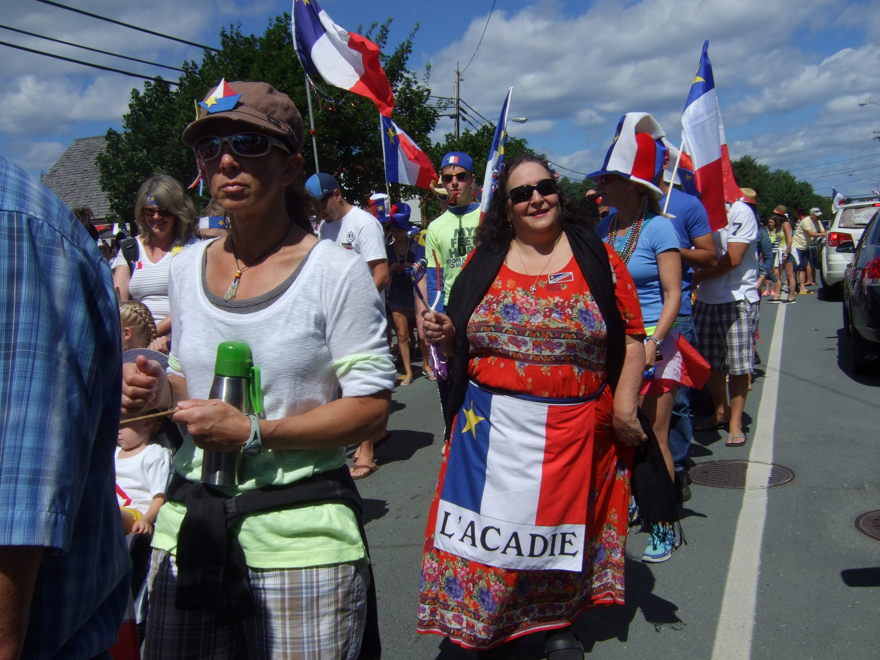 Photo of Kathi Bonnabel in parade for National Acadian Day in Bouctouche, New Brunswick.